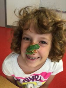 Girl at Critter Camp with frog on her nose